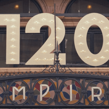 The front of Hackney Empire's entrance showing the 120th anniversary sign