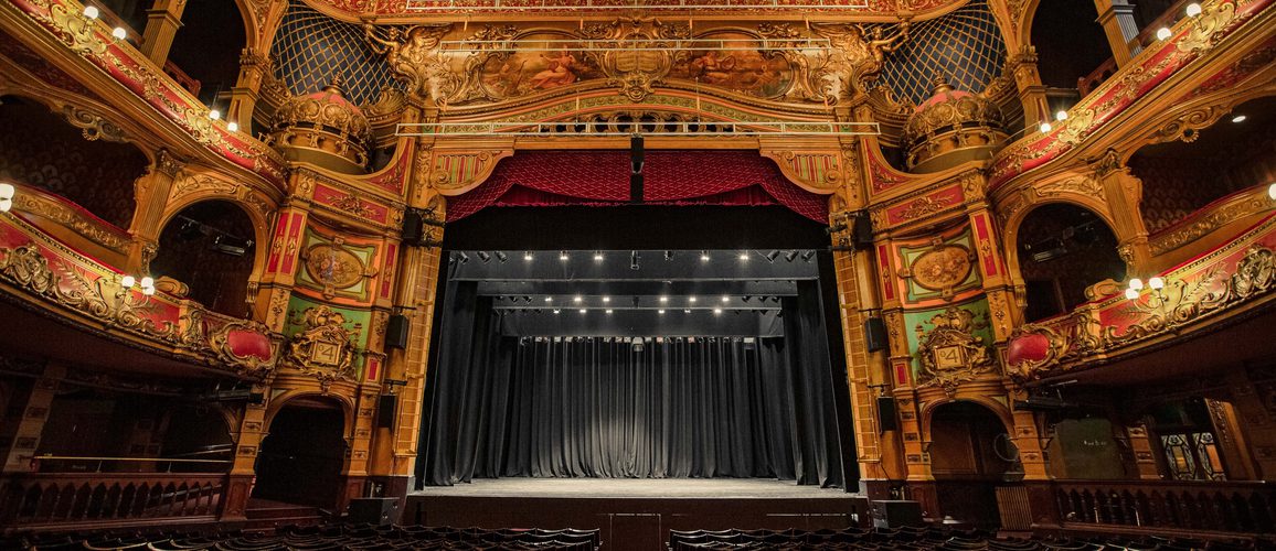 Photo taken from the back of stalls capturing the whole auditorium