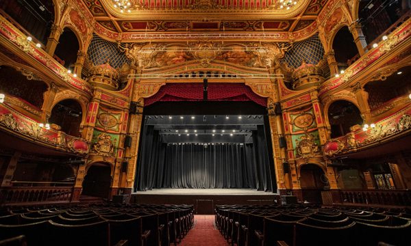 Photo taken from the back of stalls capturing the whole auditorium