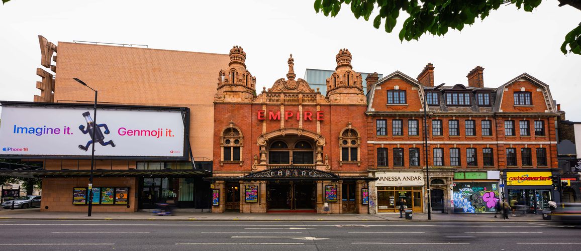 A photo of the exterior of Hackney Empire taken in 2025 from across the road on Mare Street.
