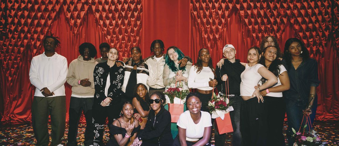 Group image of all the finalist that participated at Alter Ego 2024 with the red curtain as the background