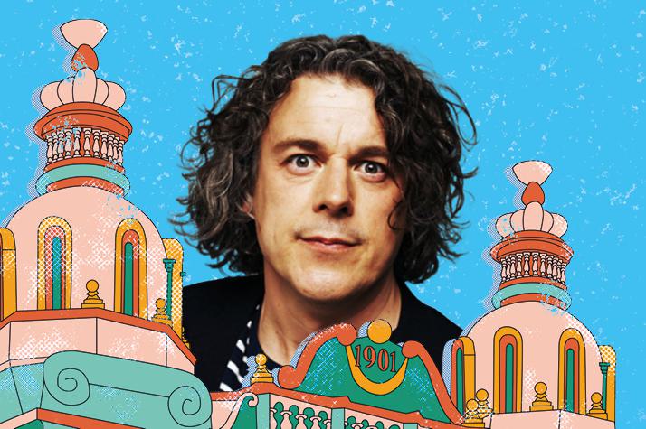 A photo of Alan Davies set against an illustration of Hackney Empire and the sky.