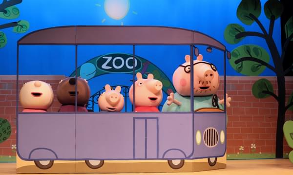 The cast of Peppa Pig's fun day out are all sitting in a car outside of the zoo.