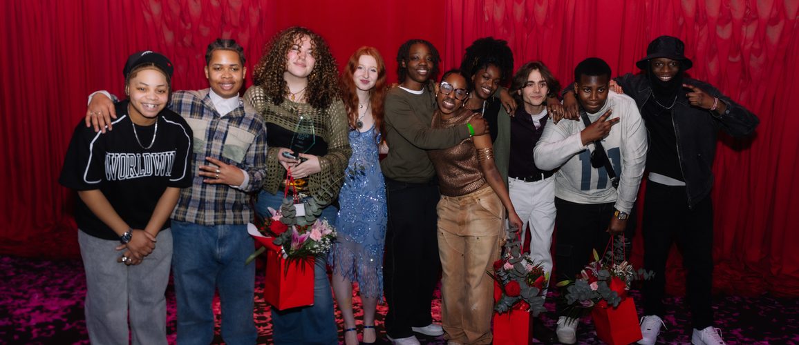 A group photo of all of the finalists of Alter Ego 2025 positioned against a red curtain