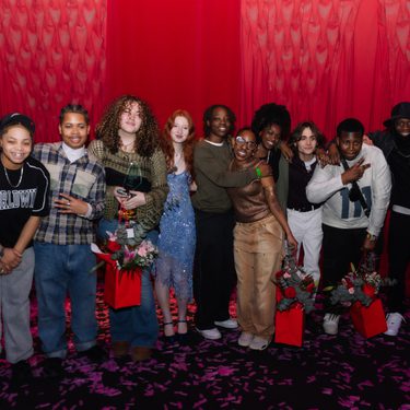 A group photo of all of the finalists of Alter Ego 2025 positioned against a red curtain