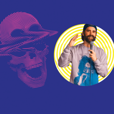 Phil Hanley is positioned against a vibrant purple background with a galaxy skull and concentric yellow circle and Phil Hanley's body is oriented towards the viewer, and his gaze is directed forward while holding a microphone.