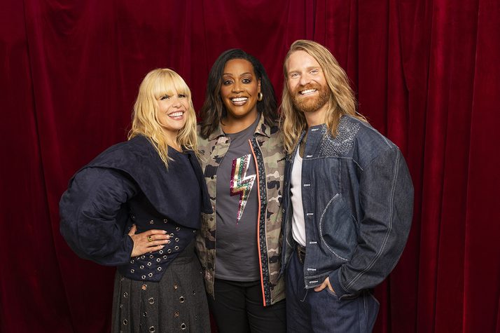 A photo of Paloma Faith, Alison Hammond and Sam Ryder all smiling and facing the camera against a red velvet backdrop