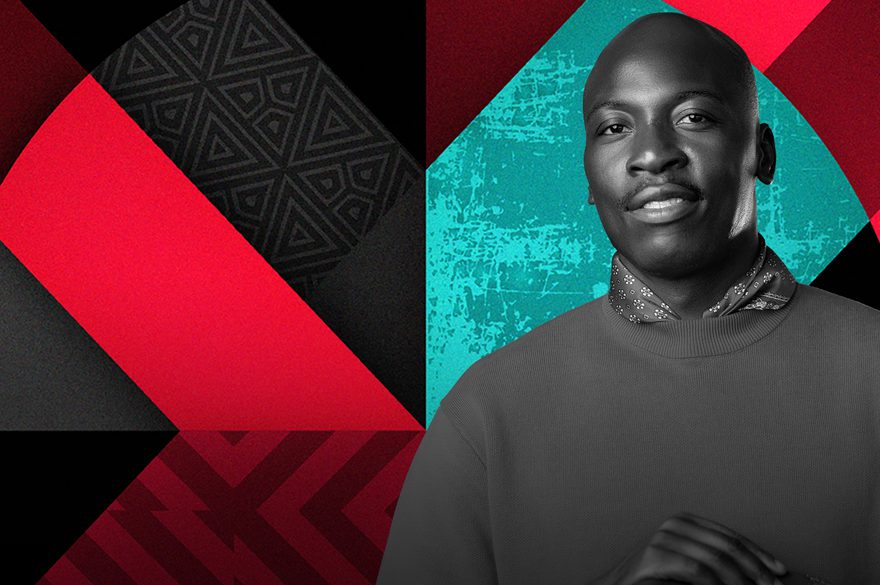 Eddie Kaddie is wearing a jumper looking straight into the camera and the 1xtra logo is behind him.