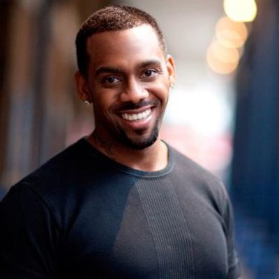 A photo of Richard Blackwood smiling at camera.
