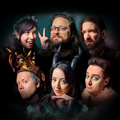 A collage of Oxventure members displaying a variety of colourful costumes and intricate makeup at a lively festive gathering.