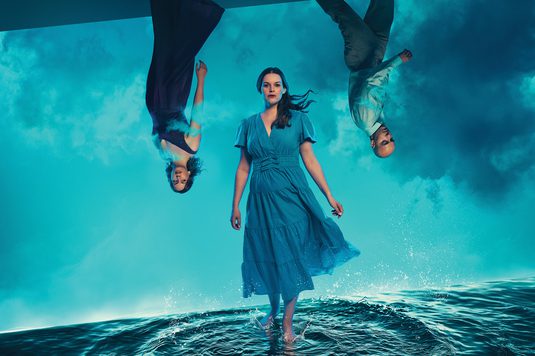 The characters from DIDO AND AENEAS stand on the sea and upside down from the sky
