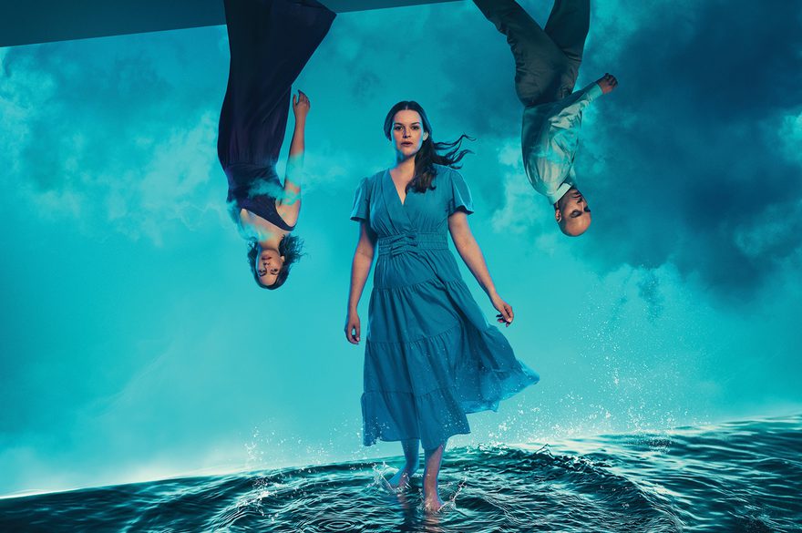 The characters from DIDO AND AENEAS stand on the sea and upside down from the sky