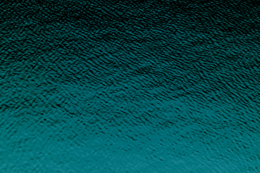 A vibrant blue ocean featuring rolling waves and a boat sailing through the water.