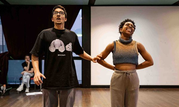 Luke Latchman as Prince Charming and Chrissie Bhima as Dandini are looking shocked/smiling.