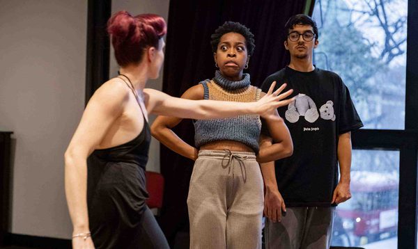 Alexandra Waite-Roberts as Oblivia is gesturing towards Chrissie Bhima as Dandini who looks terrified