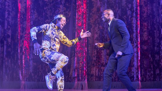 Billy Goose and Jack Goose are stood side by side almost in a running position facing each other