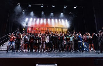 The full Company of ADP 2025 stood together on stage at the end of the show, during the bows