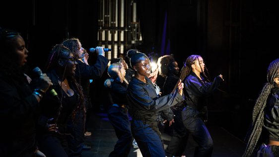 A photo taken backstage at Hackney Empire showing the ADP 2024 Company just at the end of the show.